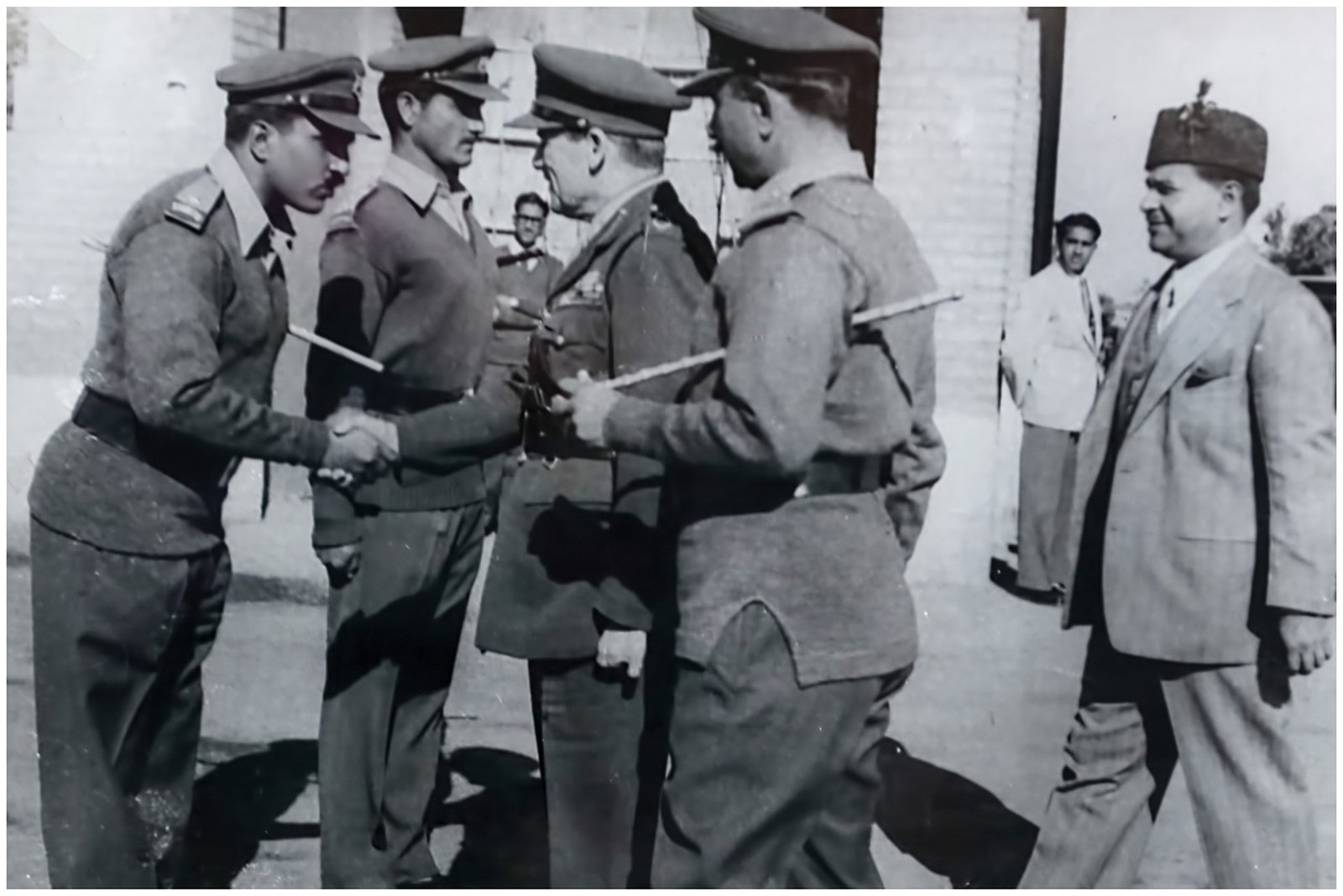 Gen. M. Zia Ul Haq (Then Major in Khyber Rifles) shaking hands with Field Marshall Harding( 1954 )