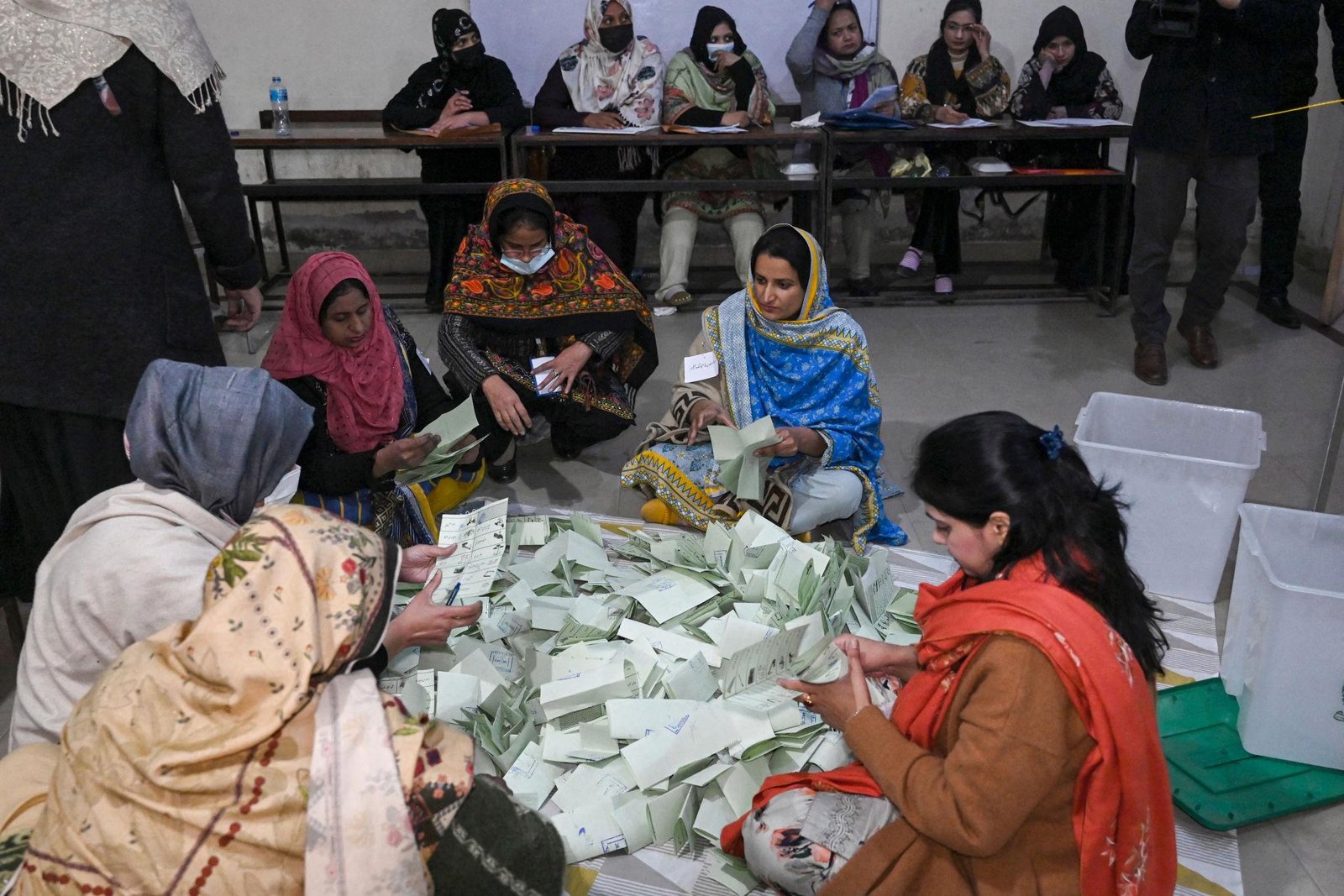 Election officials counting ballot papers during Pakistan’s general elections on 8 February 2024.